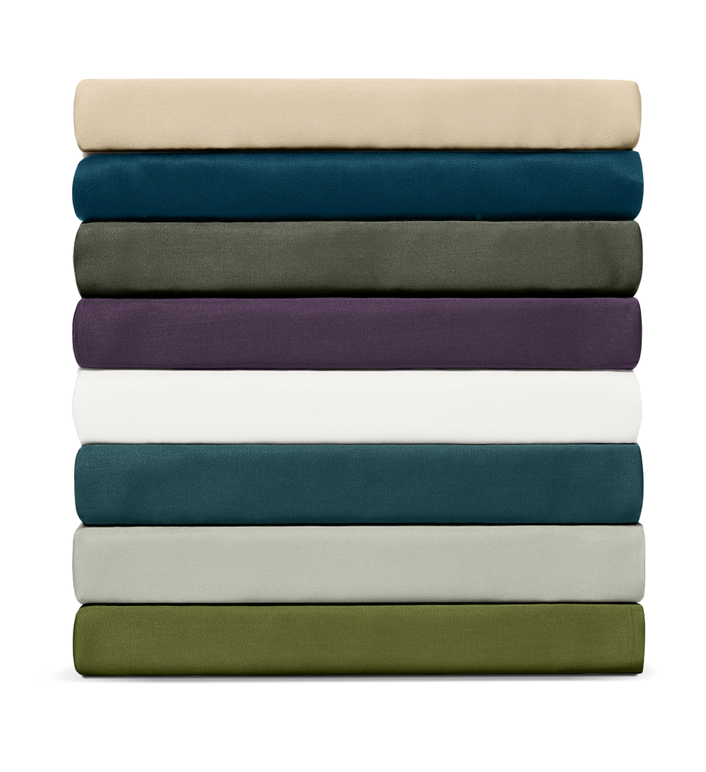 Stack of folded sheets in various colors on a white background