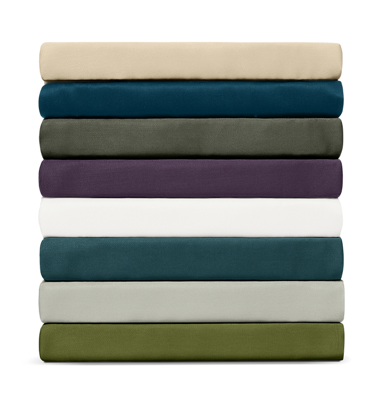 Stack of folded sheets in various colors on a white background