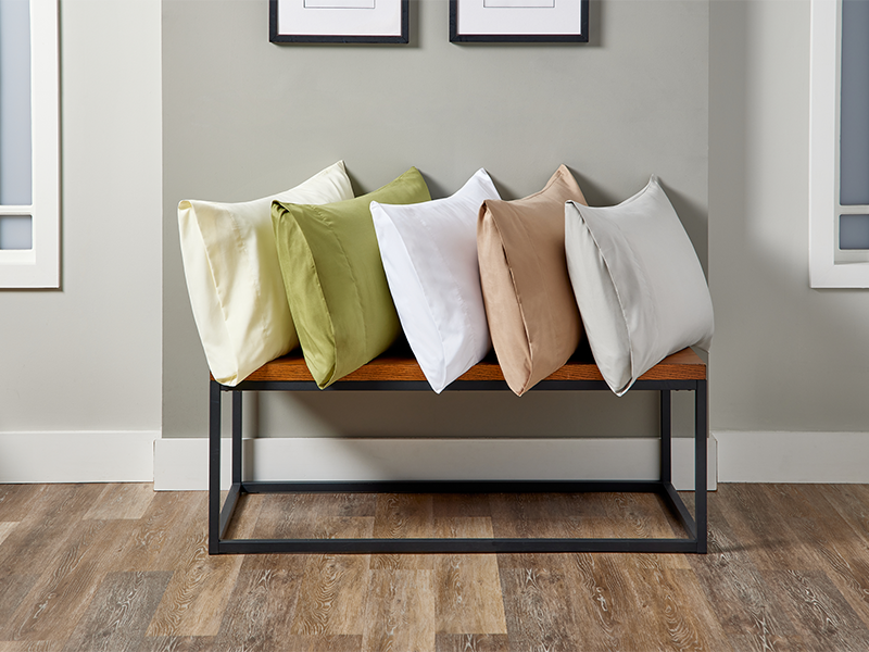 Pillows in colorful pillowcases on a rack