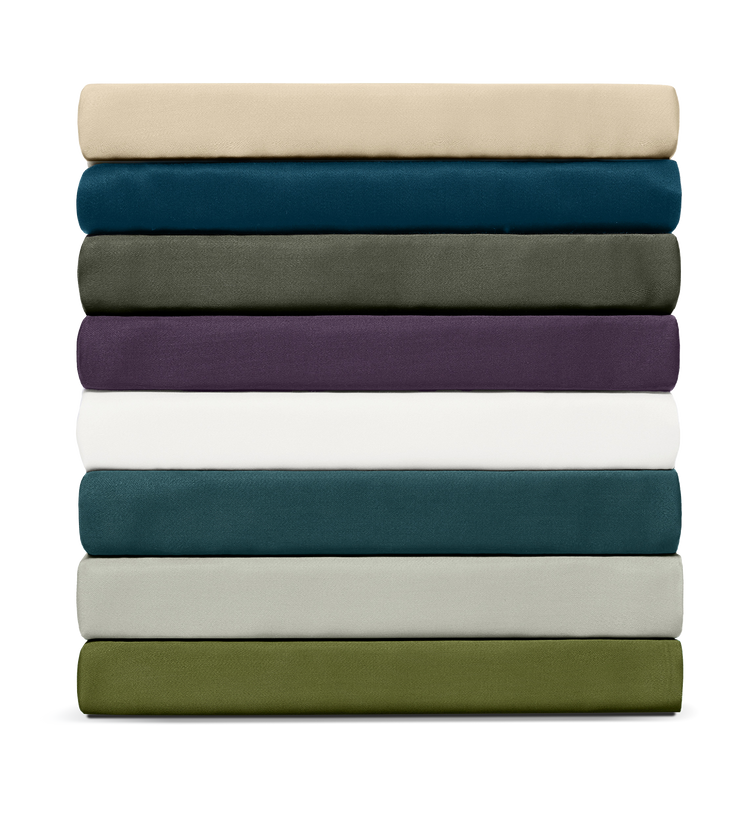 Stack of folded sheets in various colors on a white background