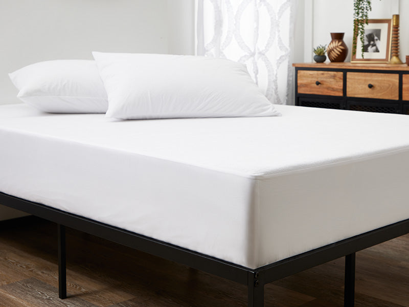 Mattress encasement on a bed